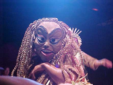 Mah Meri dancer with carved wooden mask depicting ancestral spirit (moyang)
